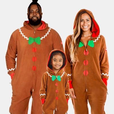 shop family onesies - image of man, woman, and child wearing gingerbread jumpsuit