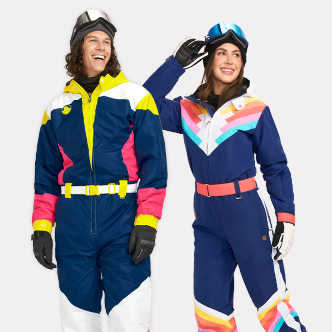 shop snow suits - image of models wearing men's neon knockout snow suit and women's santa fe shredder snow suit