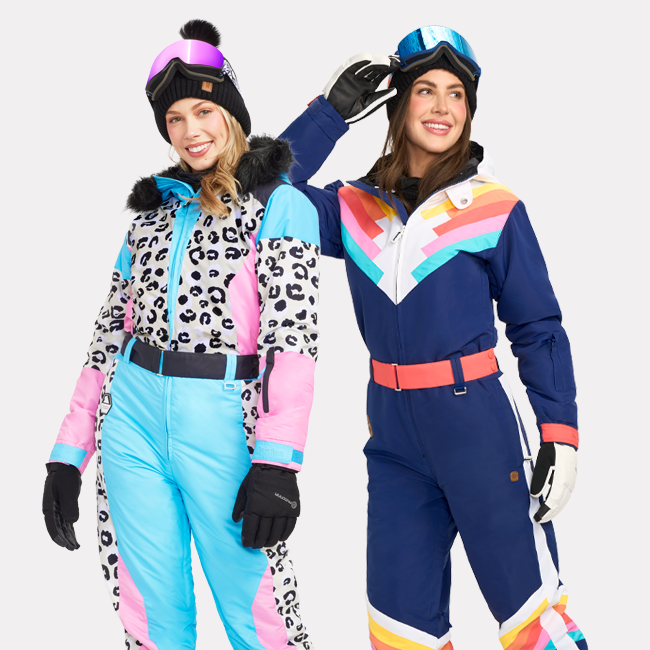 shop womens snow suits - image of models wearing women's snow leopard snow suit and women's santa fe shredder snow suit