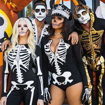 shop skeleton costumes - models wearing men's skeleton costume, men's gold skeleton costume, women's skeleton bodysuit costume, and women's sexy skeleton bodysuit costume