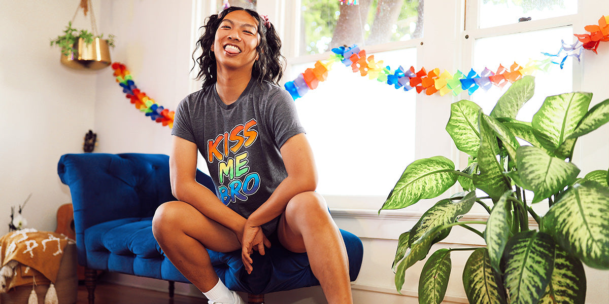 image of person wearing kiss me bro rainbow pride tee