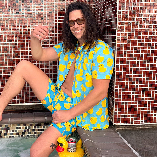 shop Hawaiian shirts - image of man wearing rubber ducky Hawaiian shirt and rubber ducky swim trunks