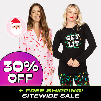shop pajamas - 30% off Cyber Monday badge - models wearing women's pink santa pajama set and women's get lit pajama set