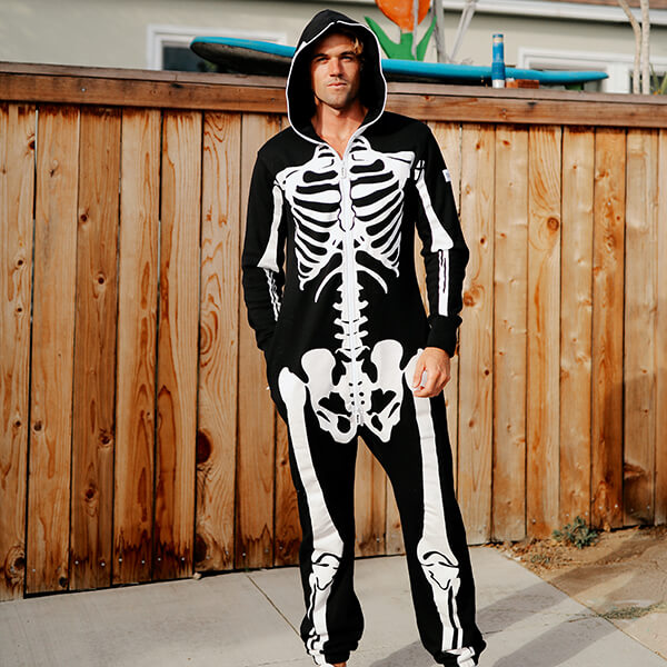 shop Halloween - model wearing men’s skeleton jumpsuit costume