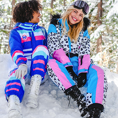 Shop winter - models wearing women's snow leopard snow suit and women's icy u snow suit