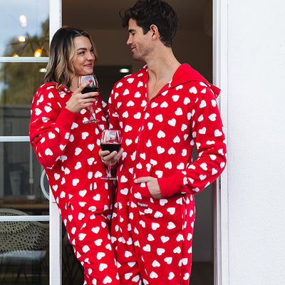 shop Valentine's Day - image of man and woman wearing beating hearts jumpsuits