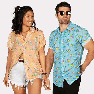 shop hawaiian shirts - woman wearing women's Pina colada hawaiian shirt and man wearing men's tacosaurus hawaiian shirt