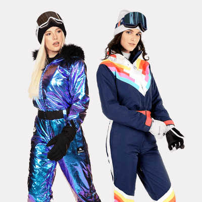 shop ski & snow suits - models wearing women's iridescent iris snow suit and women's Santa Fe shredder snow suit