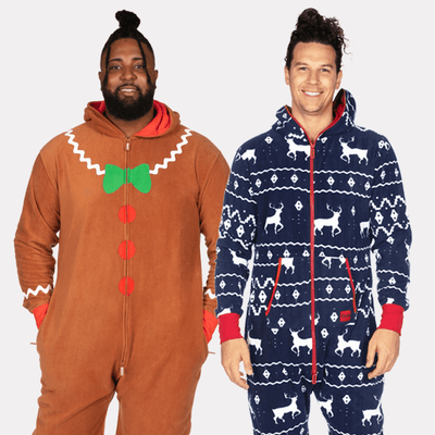 shop onesies - models wearing men's gingerbread jumpsuit and men's blue reindeer jumpsuit