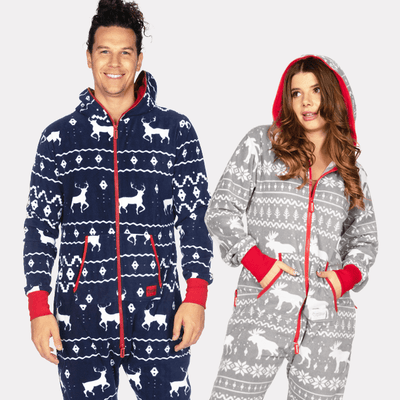 shop christmas onesies - models wearing men's blue reindeer jumpsuit and women's grey moose jumpsuit