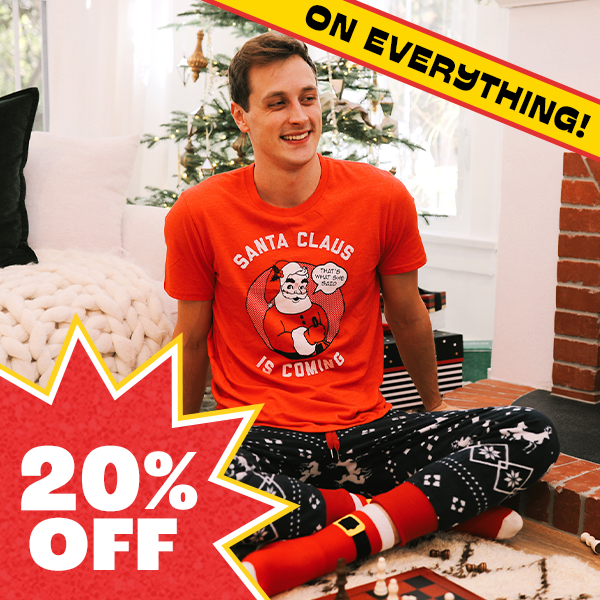 shop 20% off christmas shirts - image of model wearing mens santas coming tee