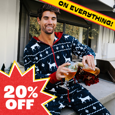 shop onesies - image of model wearing mens blue reindeer jumpsuit