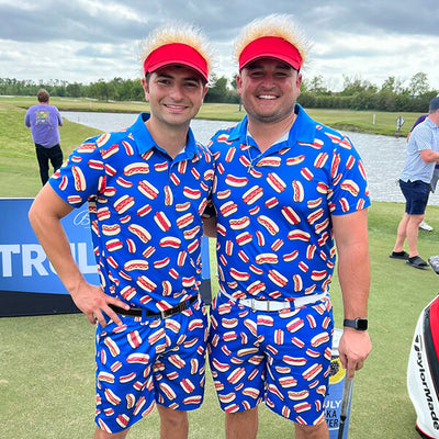 shop golf clothes - two men wearing matching men's hot dog golf polo and hot dog golf shorts