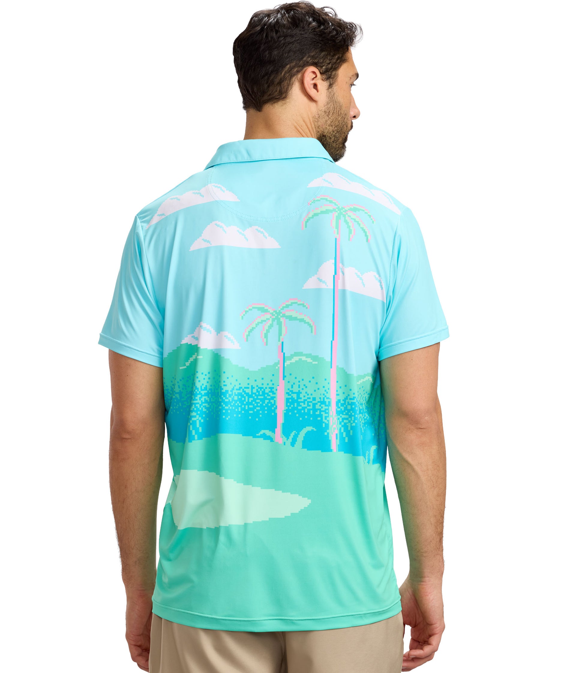 Man wearing a light blue polo shirt with palm tree and beach design on the back, standing against a white background.