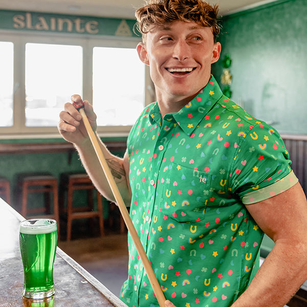 shop st. Patrick's day - model wearing men's lucky charmer button down shirt