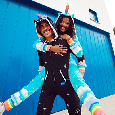 shop couples costumes - image of models wearing men's nightmare unicorn costume and women's unicorn costume