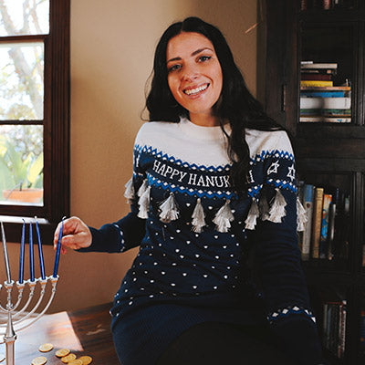 shop hanukkah - image of model wearing women's happy hanukkah tassel sweater