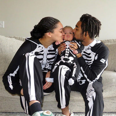shop family halloween costumes - family wearing matching skeleton jumpsuit costumes