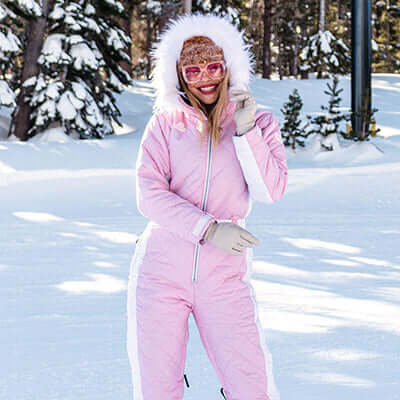 model wearing powder pink snow suit