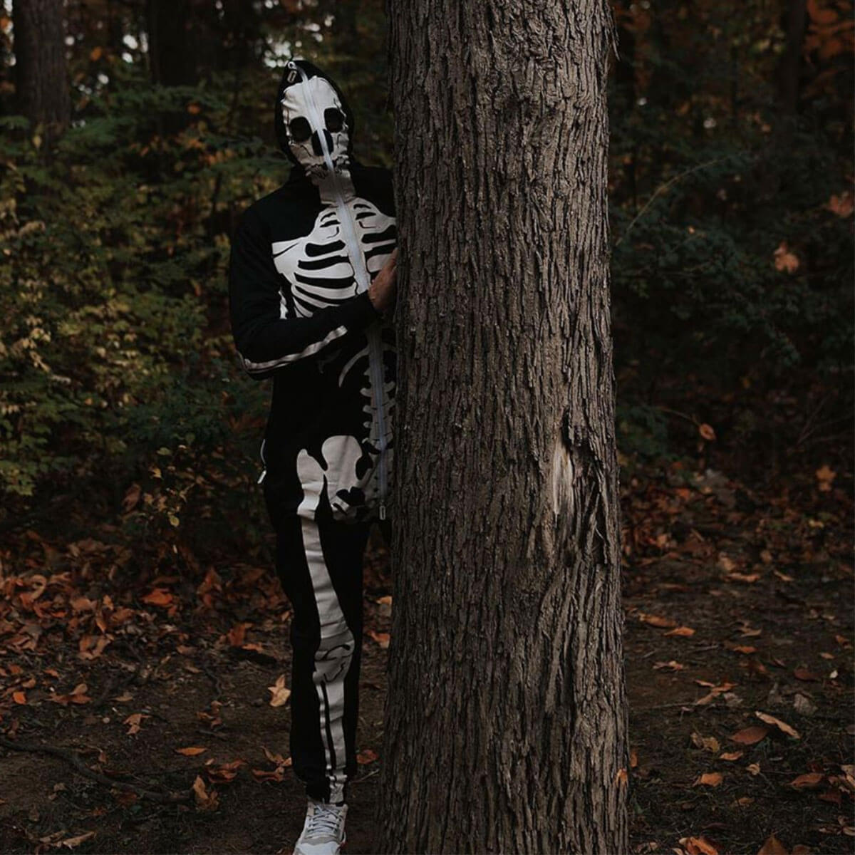 image of man wearing men's skeleton costume