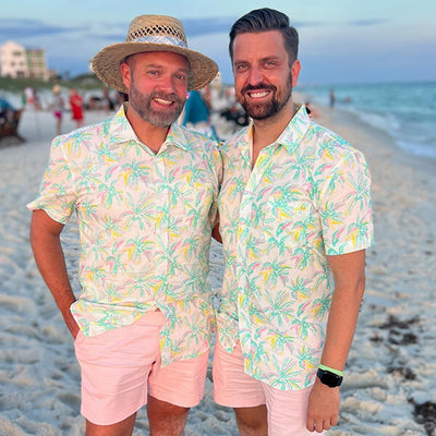 shop hawaiian shirts - two men wearing matching men's vibrant vacation hawaiian shirts