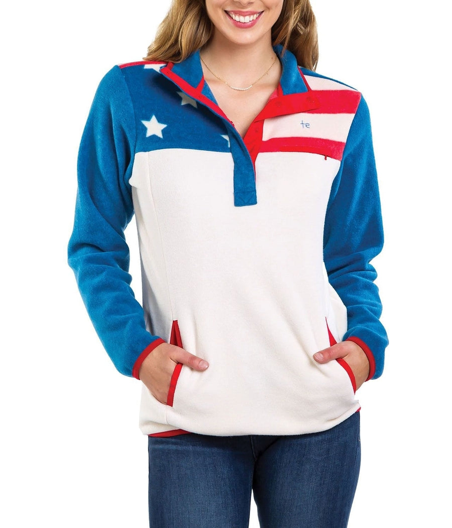 Woman wearing a colorful pullover with a star design on a white background